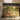 Sunlit hallway with skylight, mural wallpaper of women in traditional dress among trees, peacocks, a wood bench and vase of branches.