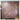 Mauve wallpaper features a shimmering gold abstract floral design; a wooden cabinet corner and cardboard box sit in the softly lit foreground.