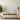 Floral-patterned neutral wallpaper sets a serene tone in a modern living room, paired with light wood furniture and green potted plants.