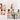 Colorful mural-style wallpaper featuring six figures in geometric-patterned outfits, some standing, others seated around a table, set on a softly textured light background.
