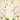 White cows adorned with red handprints and gold garlands rest and stand on pink lotus blooms, with green parrots above on leafy branches.