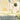 Wallpaper design featuring a white cow with a garland by a lotus pond, delicate pastel buildings, trees, and floral patterns in the background.