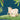 Wallpaper design featuring a decorated cow and calf on grass, framed by bold green leaves with a soft blue background.