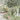 Elegant wallpaper pattern shows women boating on a pond, swans, lush florals, classic statues, and grand columns in soft hues.