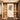 An ornate wallpaper frames a serene home altar with hanging lamps, lotus-adorned deity art, and elegant framed pictures.