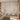 Nature-themed mural wallpaper with a tree, birds, butterflies, and foliage in soft neutrals, complementing cozy bedroom decor and floral accents.