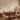 Leafy branch mural in soft greens behind a beige sofa and wooden coffee table sets a warm, inviting mood in this mid-century living room.