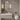 Bathroom with floral wallpaper, floating marble vanity, vessel sink, gold touches, sconces, modern toilet and leafy vase decor.