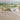Farm-Joy: Sunny Farm With Barns, Animals, Windmill, Sunflowers, and Rolling Hills