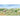Whimsical countryside wallpaper featuring vibrant barns, farm animals, sunflowers, a tractor, windmill, rolling hills and a bright blue sky.