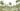 Elegant watercolor mural of a woodland scene with green trees, soft mountains, a pond, and forest animals on grassy terrain with rocks and a log.