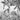 Monochrome mural design featuring lush banana and palm trees, a perched monkey, a heron, scattered birds, and distant colonial buildings.