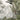 Tropical-themed wallpaper featuring a flag-bearing rider on a decorated elephant, partly hidden by lush foliage and misty silhouettes of trees.