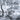 Monochrome mural-style wallpaper featuring a peaceful rural village scene with riverside houses, trees, grazing cows, and strolling villagers.