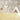 Safari animal mural fills one wall of a children‚Äôs room, complemented by light wood floors, a cream teepee, soft cushions, and playful wooden toys.