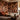 Amber-Veil: Abstract Earth Tone Mural of Three Women Relaxing Among Tropical Plants and Flowers